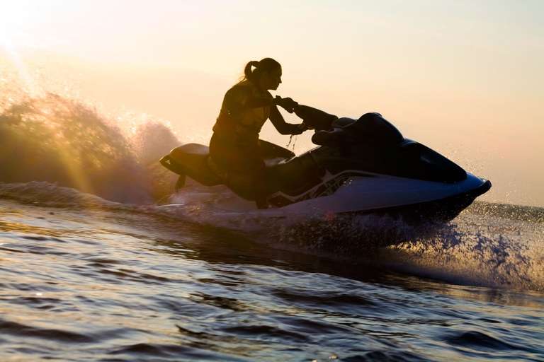 Silhouette of a girl on a jet ski, get a jet ski license Florida concept. 