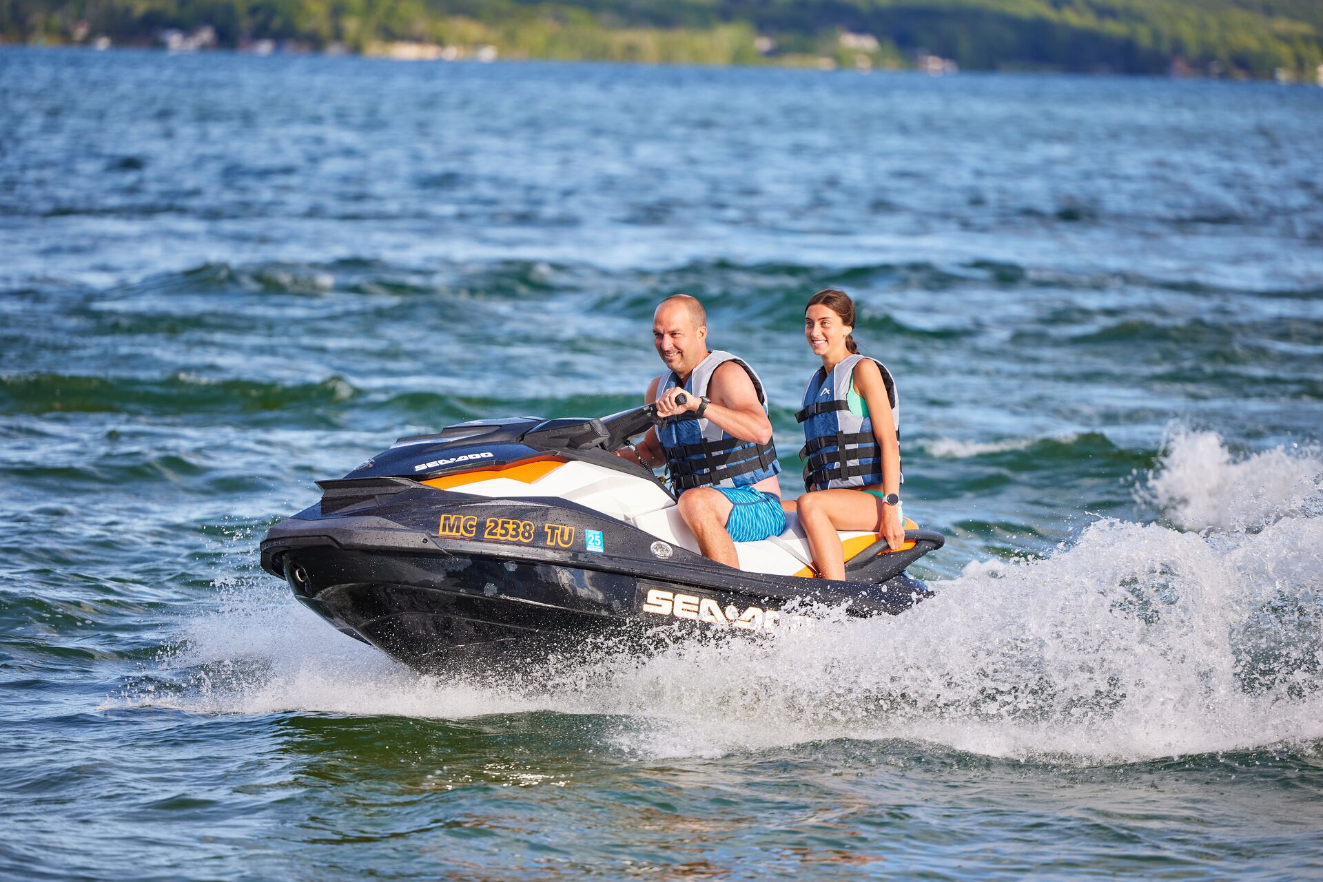 Man and girl on jetski, best boating lakes in FL concept.