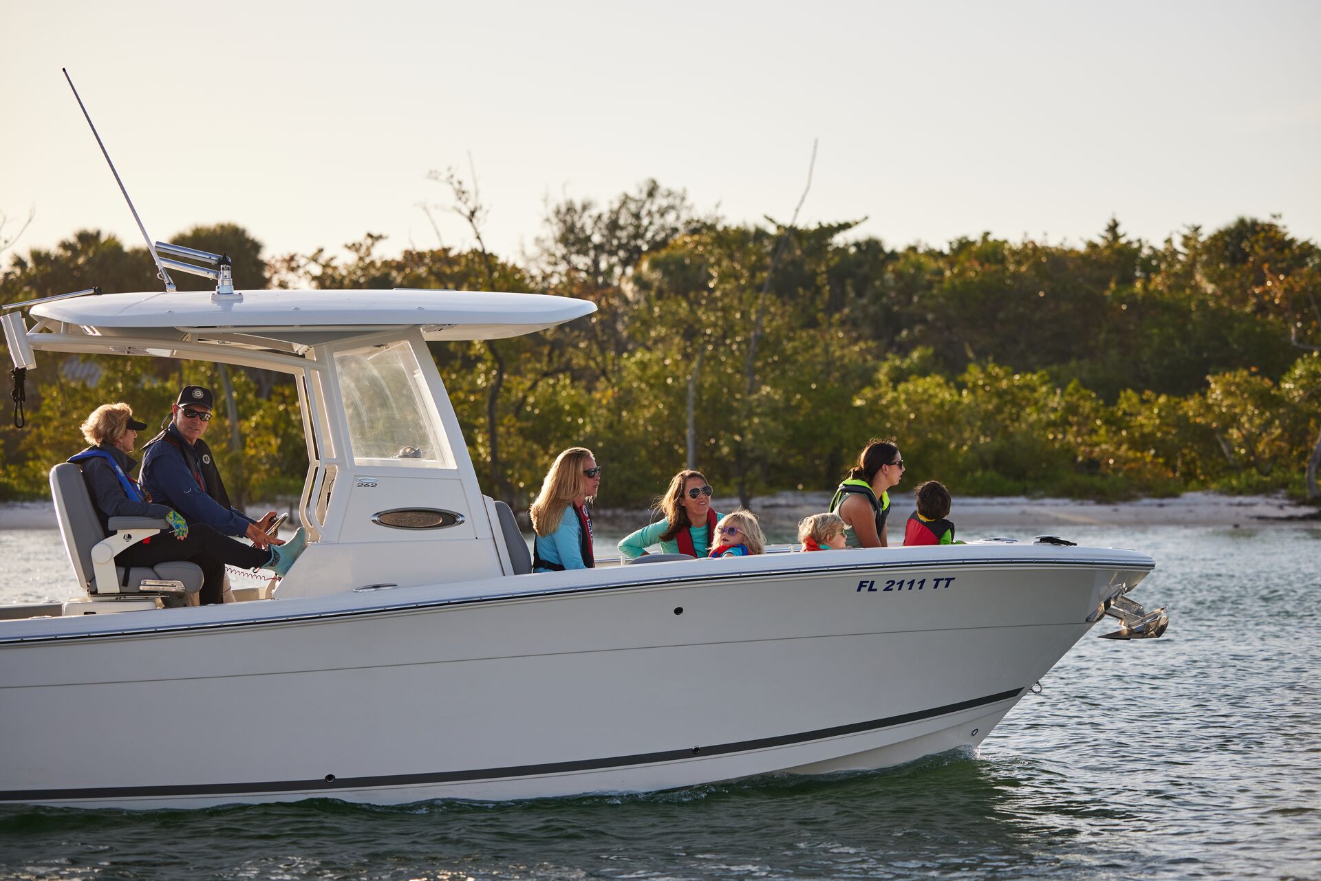 A boat carrying several people on the water. 