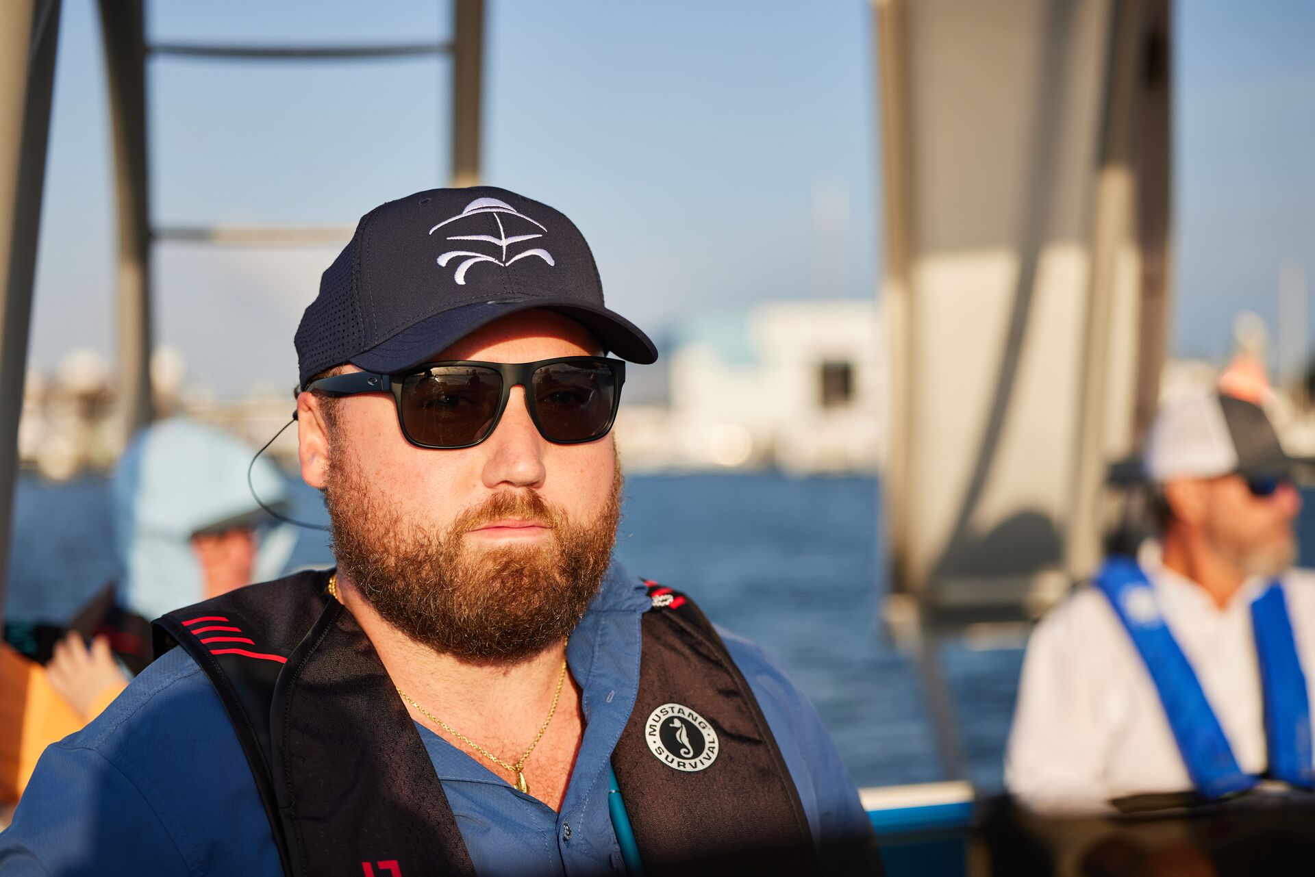 A man wears a life jacket for safe boating, gathering distress signals concept. 