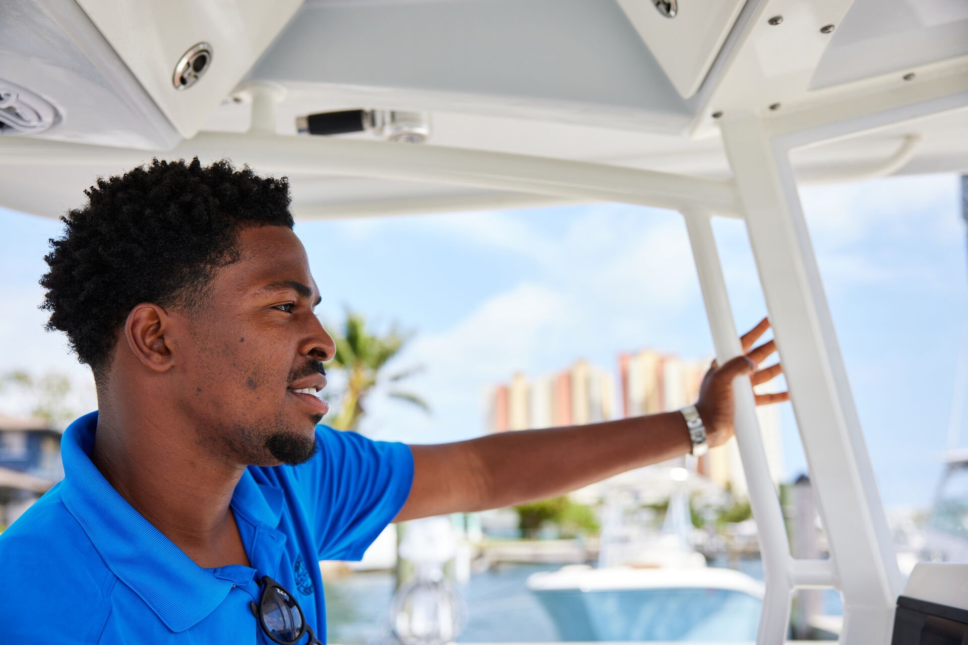 A man drives a boat safely to avoid a boating accident.