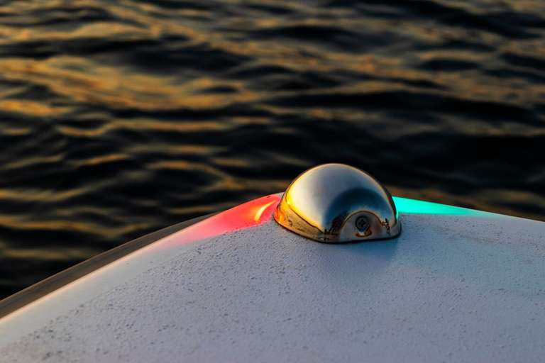 A red and green light on the front of a boat. 