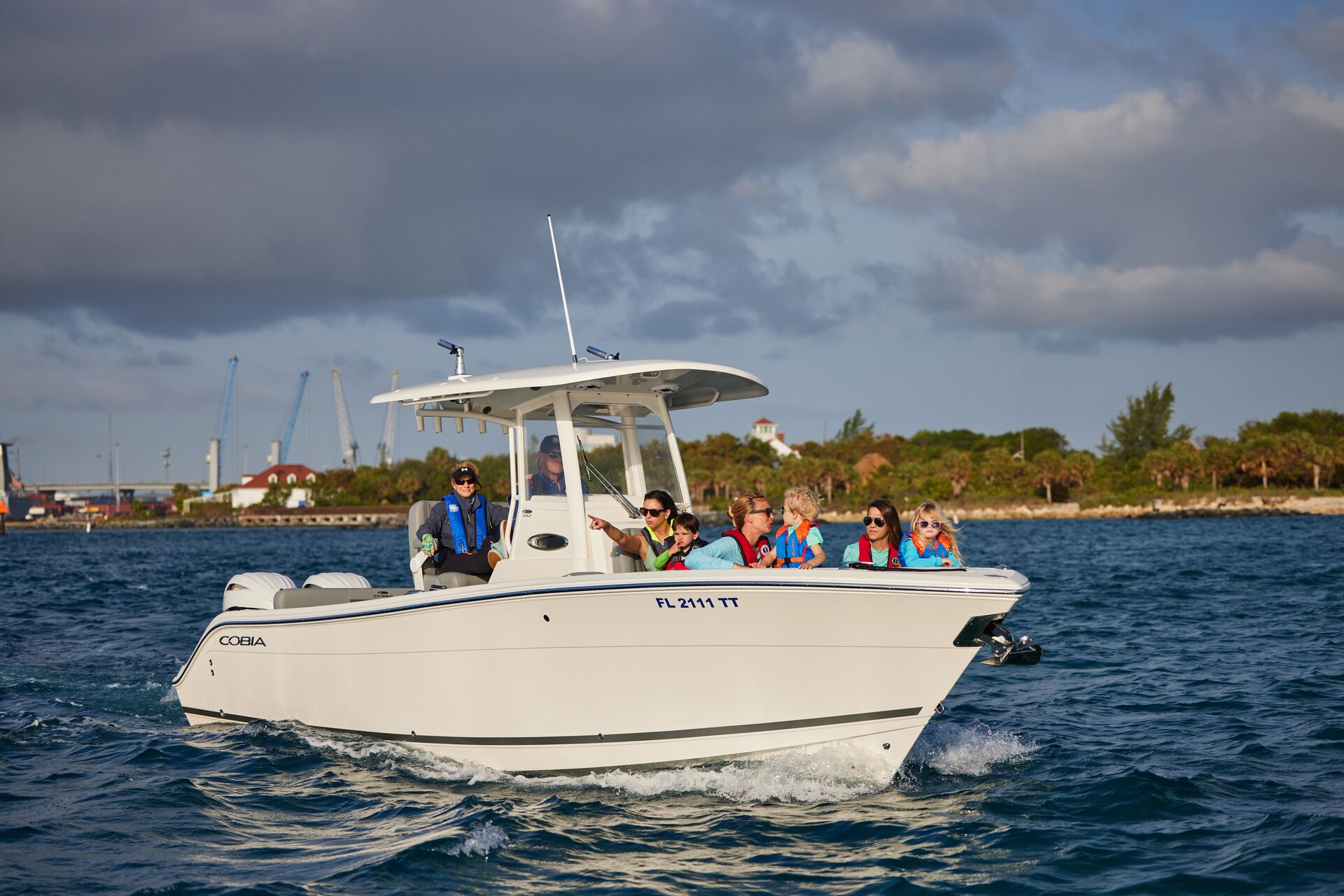 A boat full of passengers on the water, boating safety tips for older adults concept.