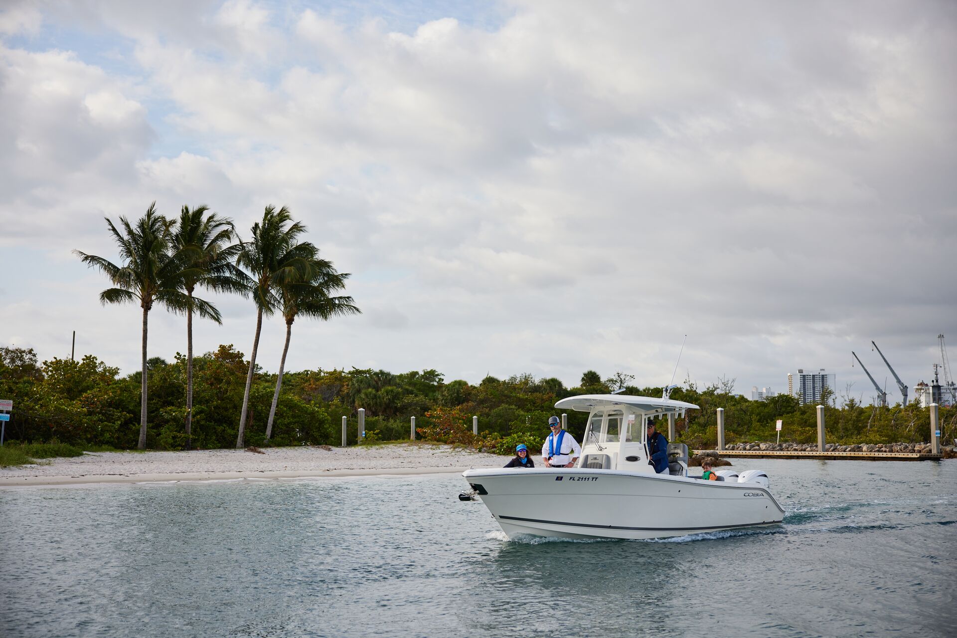 People on a boat operating close to shore.