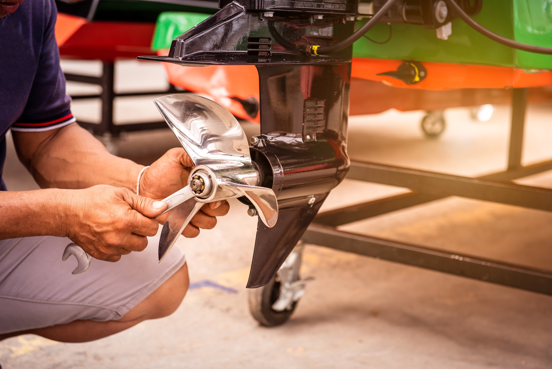 Person working on a boat propeller. 