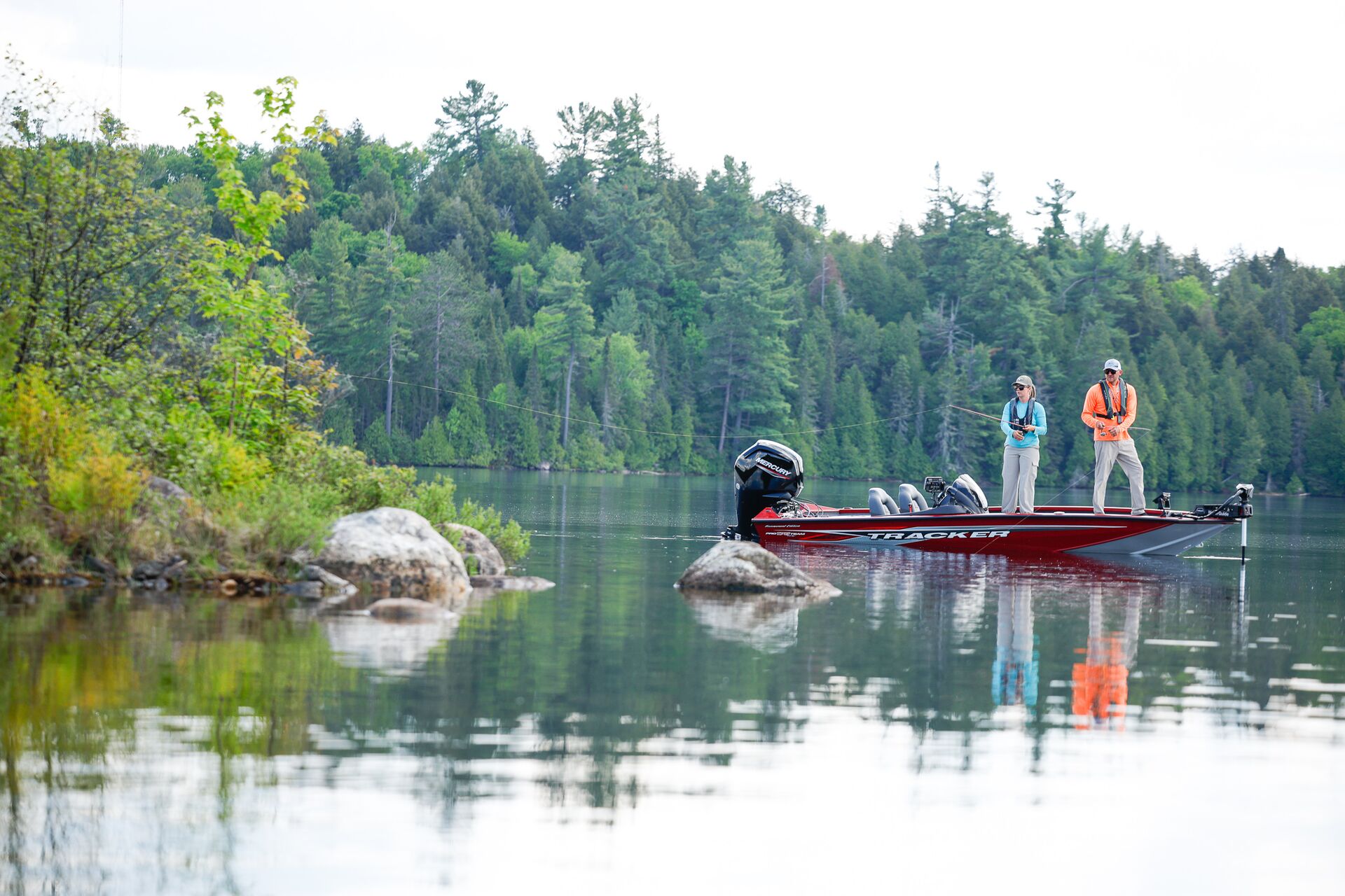 Man and woman fishing from a boat, Alligator River National Wildlife Refuge Fishing concept.