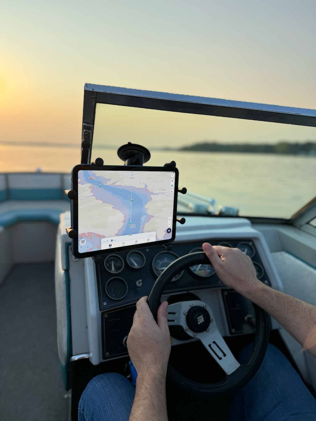 Wavve boating app on an ipad screen on a boat.