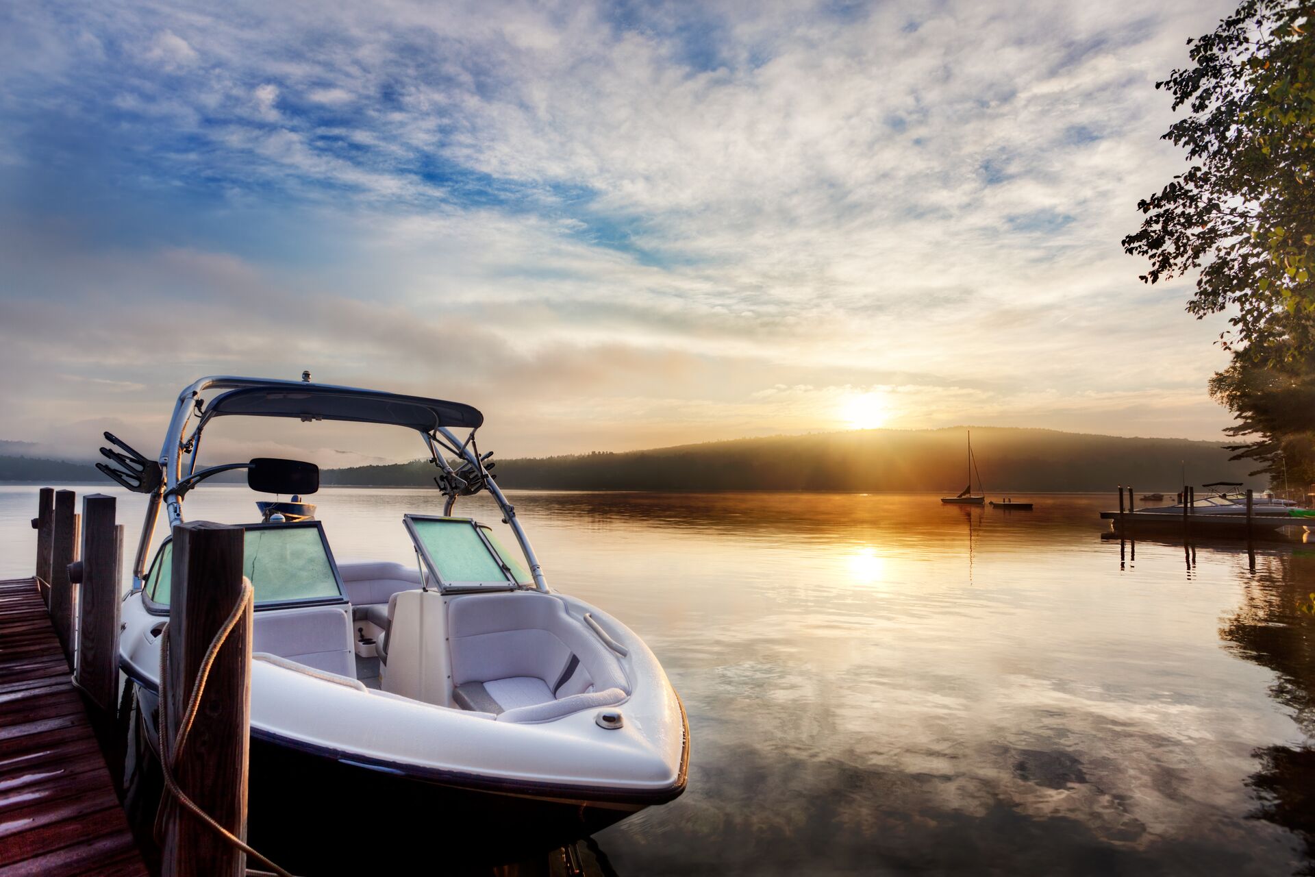 Boat at dock at sunset, boat mooring concept. 