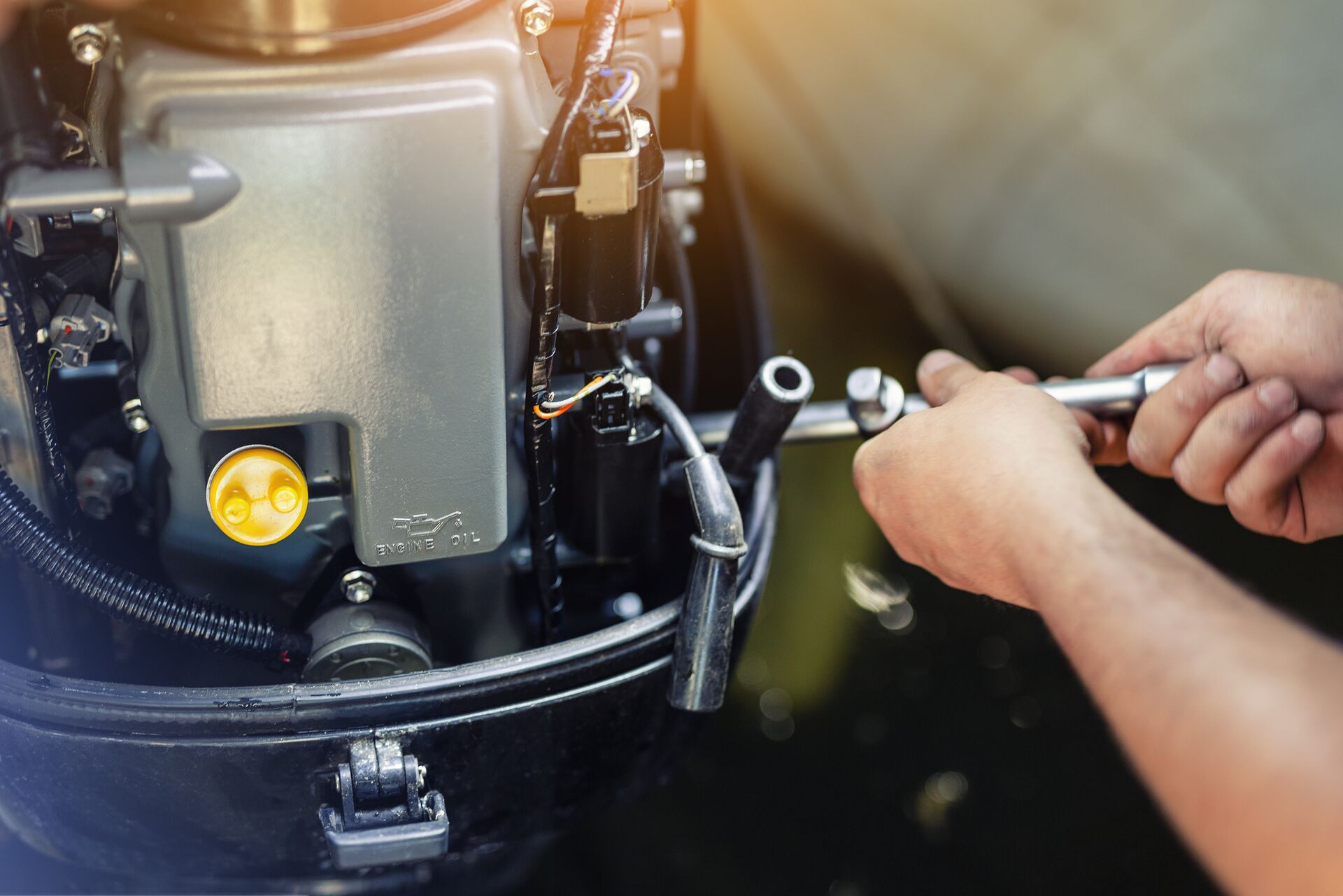 Close-up of hands working on a boat, know the parts of a boat concept.
