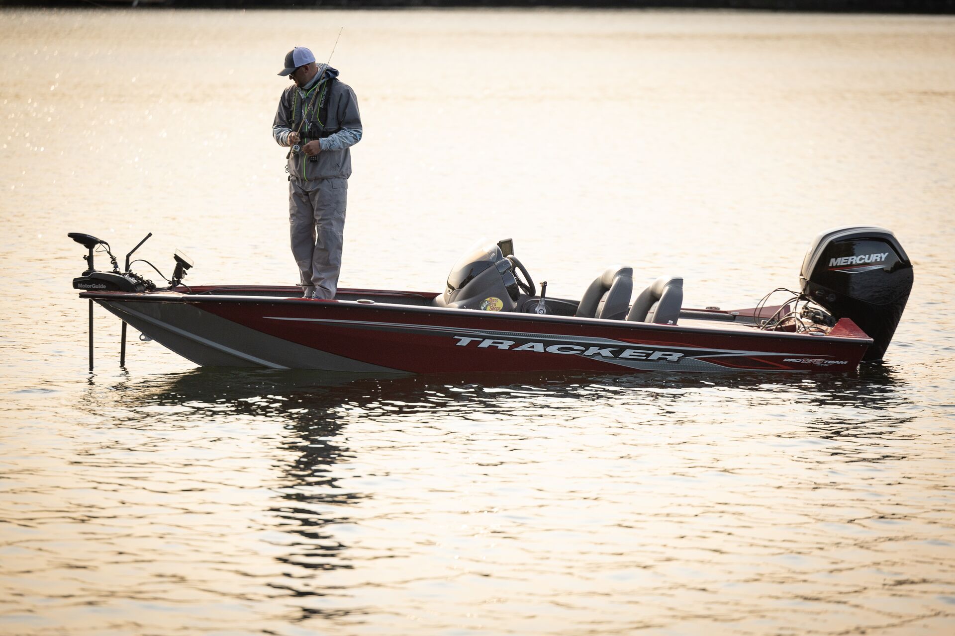 Angler on a fishing boat in the water.