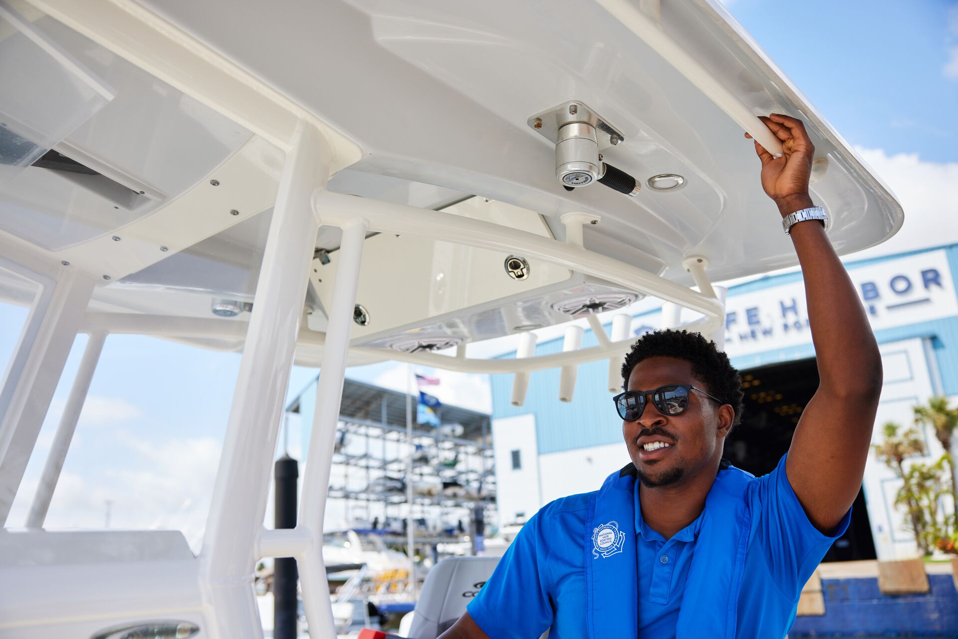Man smiles while driving boat, meeting WA boating requirements concept. 