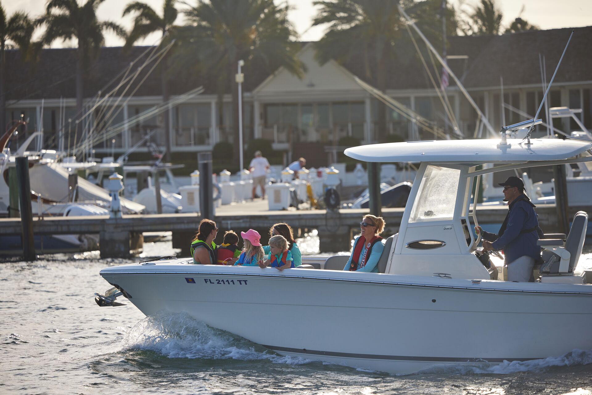 A view of the port side of a boat carrying people on the water. 