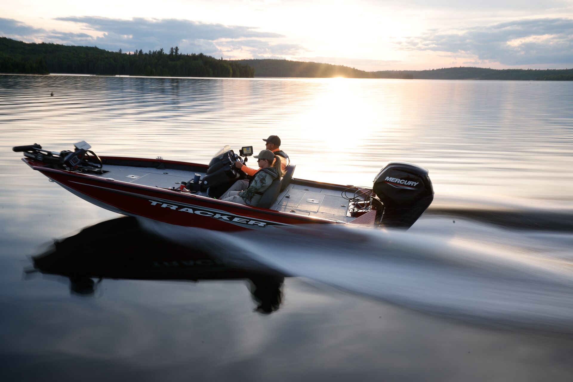 Man and woman on fast-moving fishing boat, how do I learn to drive a boat concept. 