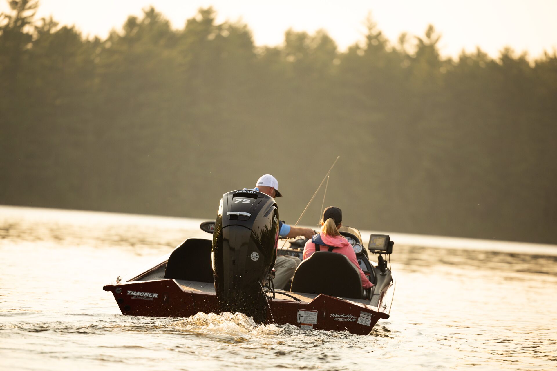 Back view of two people on a fishing boat, get a California boating license concept. 