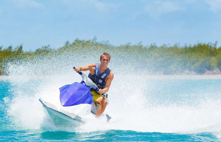 Guy riding jet ski, do you need a jet ski license in California concept. 